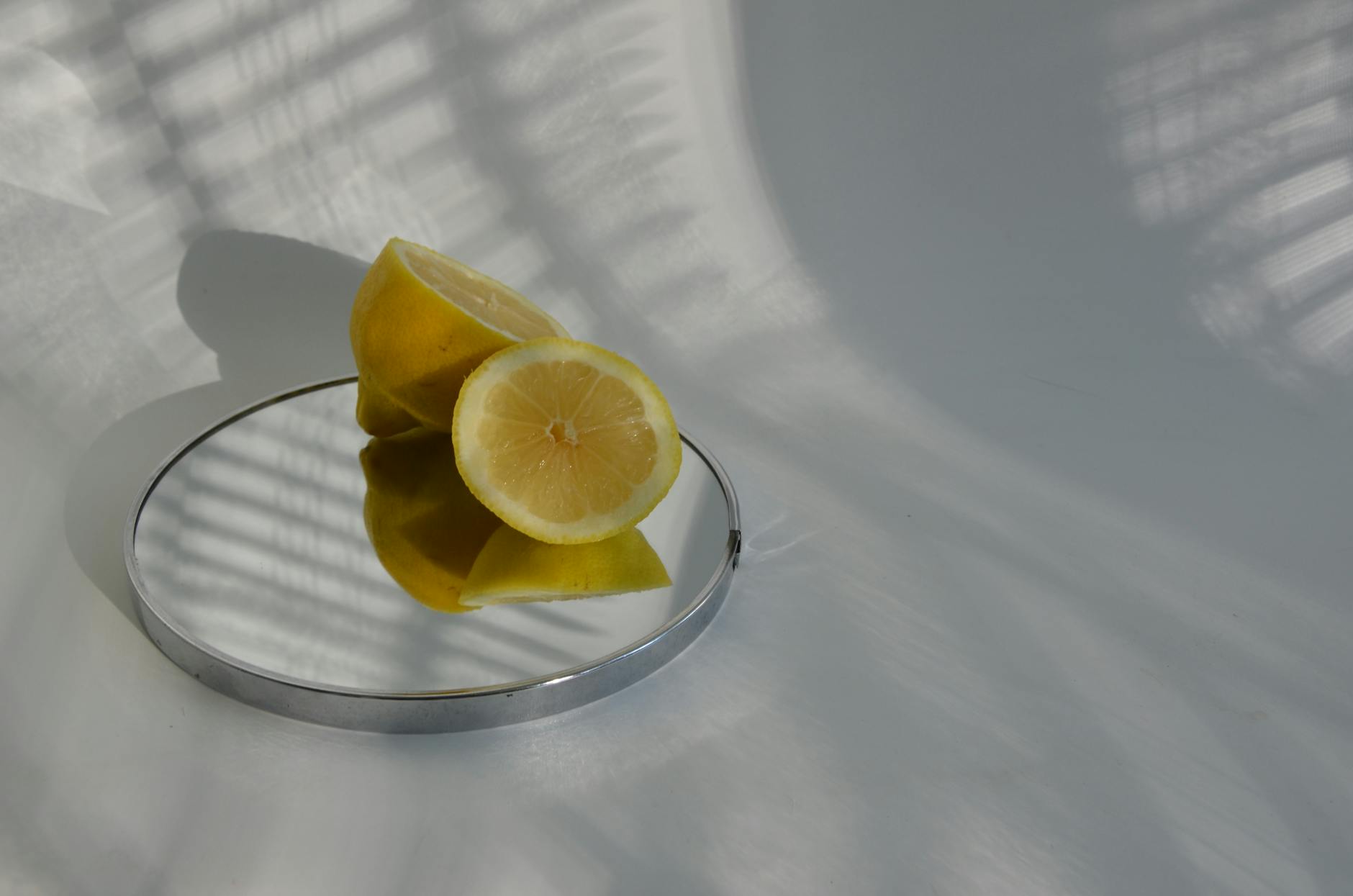 Bright yellow lemons arranged on a pastel background, symbolizing fresh approaches to sexual pleasure after medication changes.