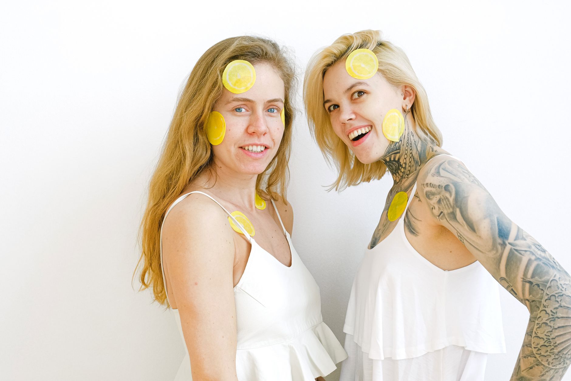 Bright yellow lemons on a pastel green background, symbolizing freshness and renewal